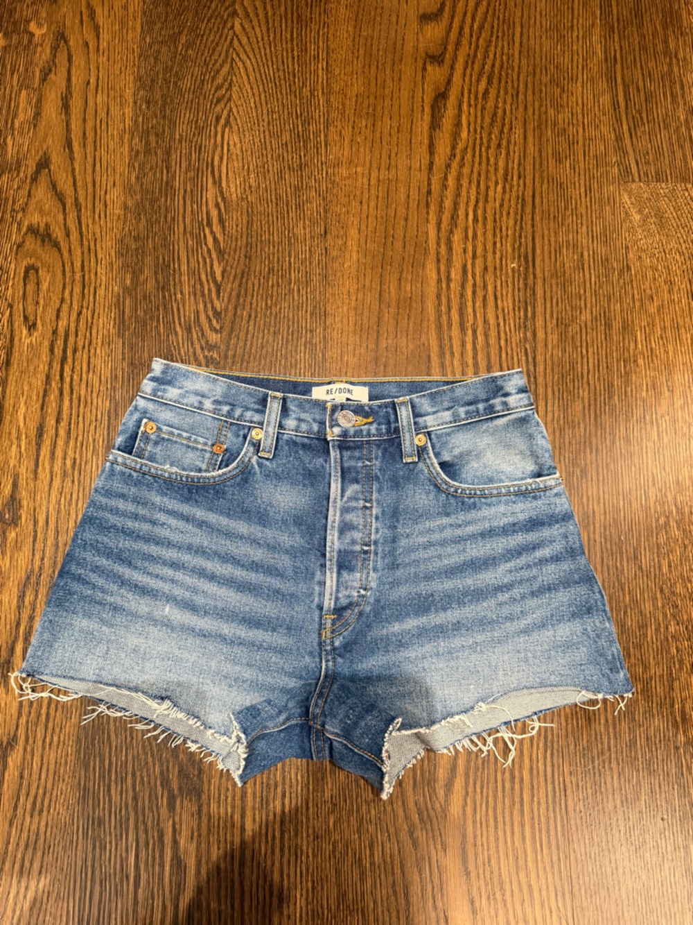 Re/Done Faded Blue High-Rise Distressed Jean Shorts